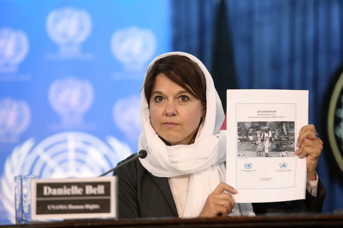 Danielle Bell, United Nations Assistance Mission in Afghanistan, UNAMA, Human Rights Director shows a copy of the United Nations casualty report during a press conference in Kabul, Afghanistan, Wednesday, Aug. 5, 2015. (AP Photo/Rahmat Gul)