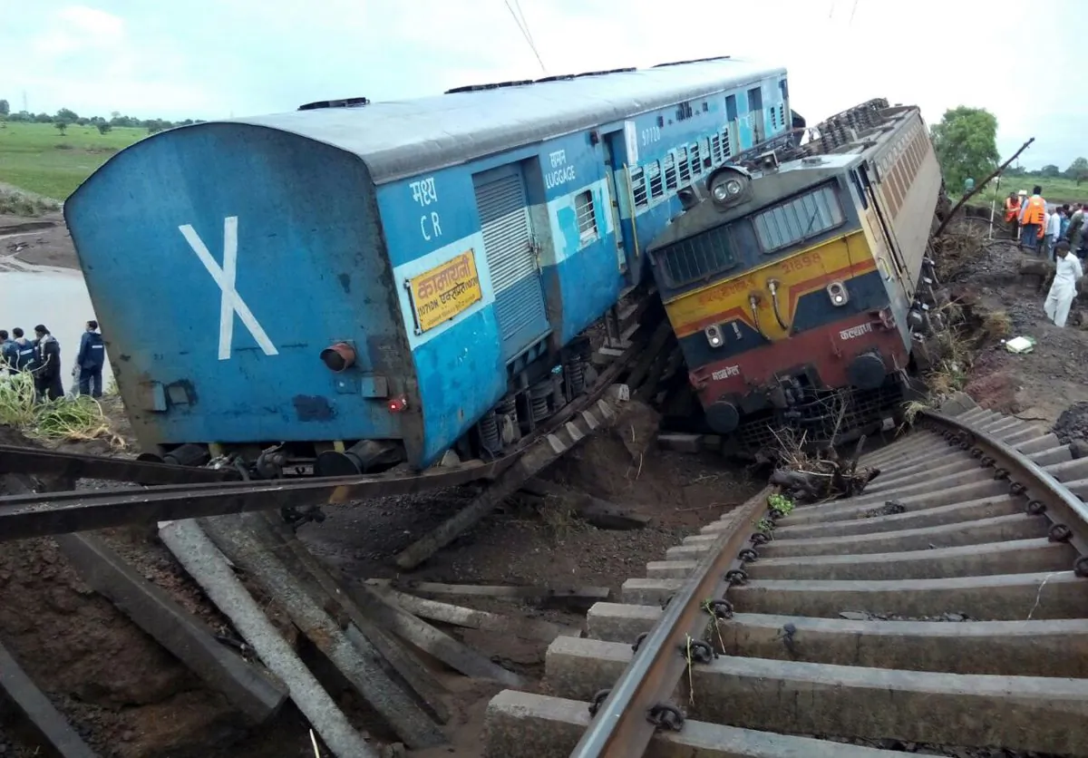 Two Indian passenger trains lay next to each other following a derailment after they were hit by flash floods on a bridge outside the town of Harda in Madhya Pradesh state on August 5, 2015. At least two dozen were killed in the latest deadly accident on the nation's crumbling rail network. (AFP/Getty Images)