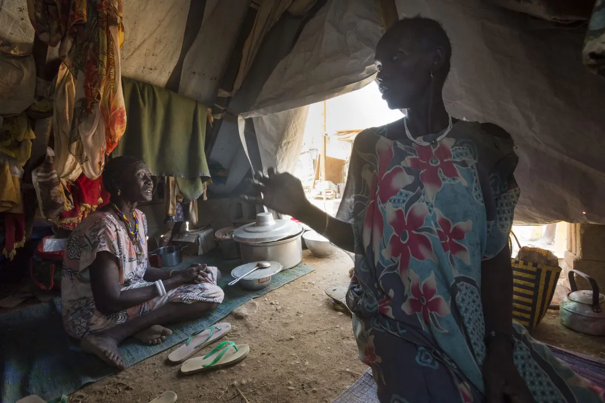 Mary and her sister, Martha Aylynyayuach, find a safe shelter at the UN House IDP Camp in Juba, South Sudan, on Feb. 2014. (Petterik Wiggers/Oxfam East Africa/Flickr/CC BY)