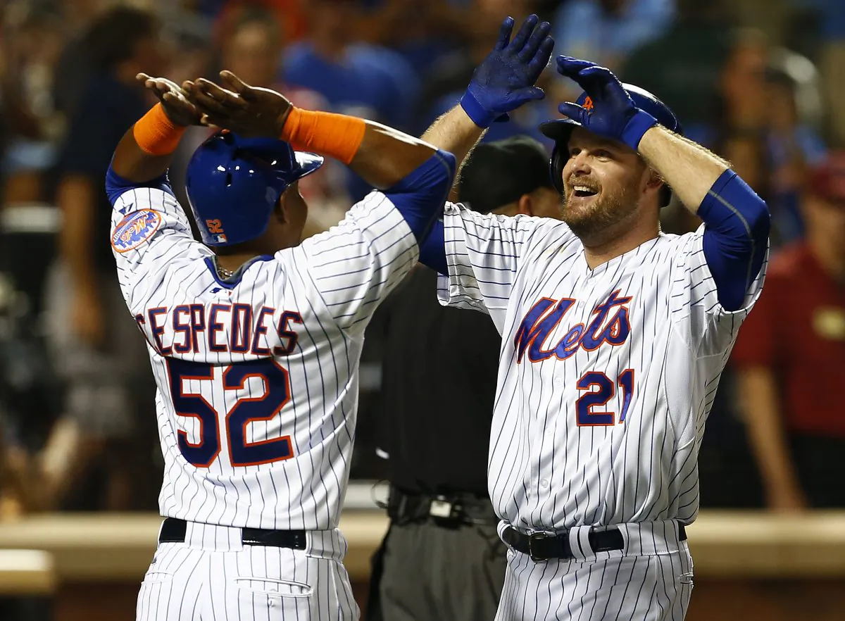 Mets sluggers (L) Lucas Duda and the newly-acquired Yoenis Cespedes have helped New York climb into first place in the NL East. (Rich Schultz/Getty Images)