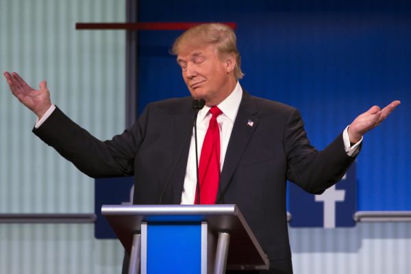 Republican presidential candidate Donald Trump gestures during the first Republican presidential debate at the Quicken Loans Arena Thursday, Aug. 6, 2015, in Cleveland. (AP Photo/John Minchillo)