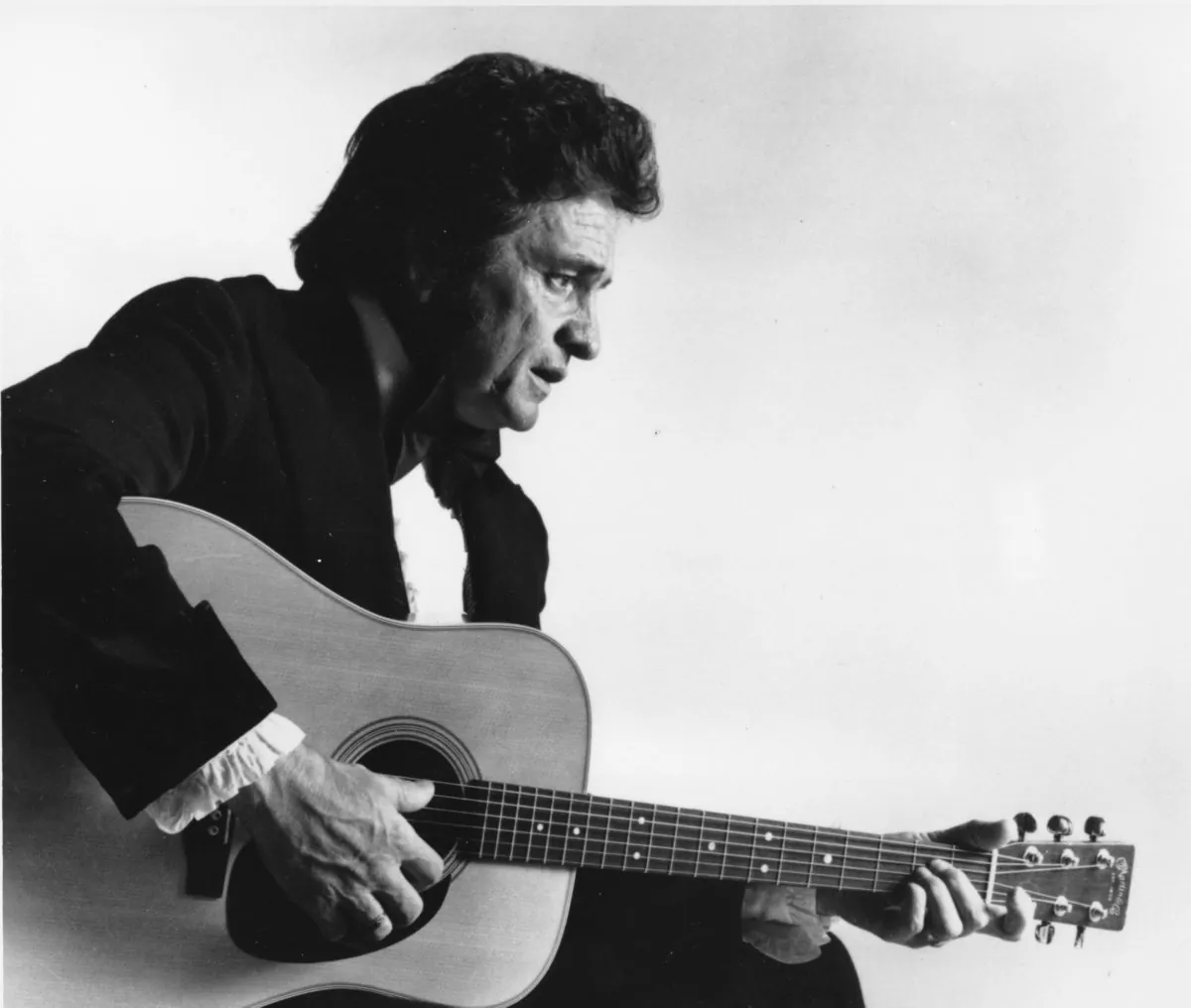This is a 1977 file photo of country western musician Johnny Cash. A concert marking the 40th anniversary of Cash's famous concert at Folsom State Prison scheduled for Sunday, Jan. 13, 2008, has been scraped, with the prison and the promoter blaming each other for the cancellation. (AP Photo, file)