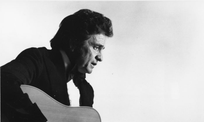**FILE** This is a 1977 file photo of country western musician Johnny Cash. A concert marking the 40th anniversary of Cash's famous concert at Folsom State Prison scheduled for Sunday, Jan. 13, 2008, has been scraped, with the prison and the promoter blaming each other for the cancellation. (AP Photo, file)