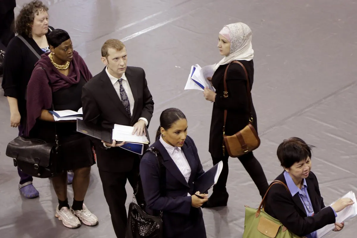 Job hunters line up for interviews at an employment fair sponsored by the New York State Department of Labor in Brooklyn, New York, on Oct. 8, 2014. (Mark Lennihan/AP Photo)