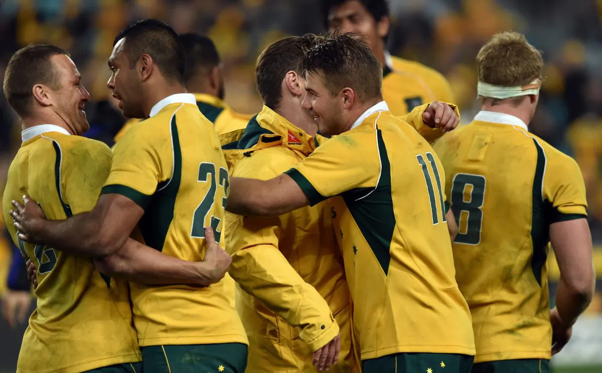 Australia's players celebrate their victory against New Zealand All Blacks in the Bledisloe Cup Test match as part of the Rugby Championship in Sydney on August 8, 2015. (Saeed Khan/AFP/Getty Images)