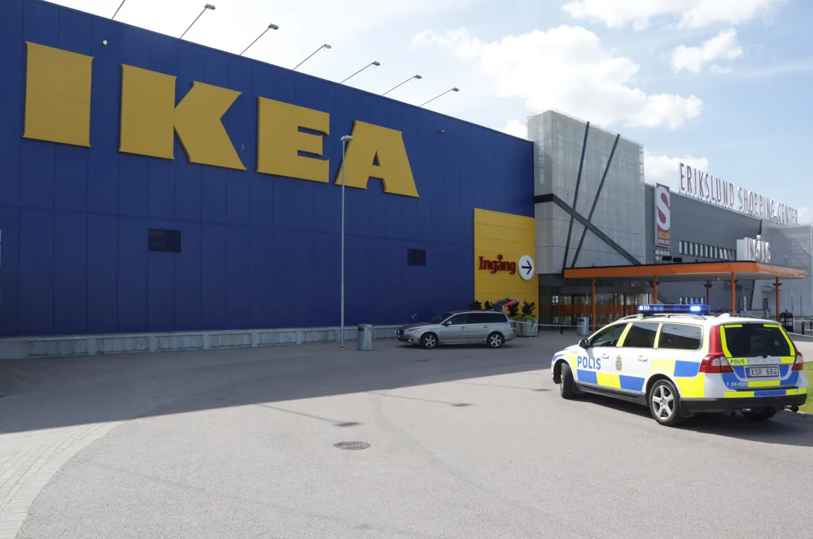 Police officers attend the Ikea store in Vasteras, Sweden, Monday Aug. 10, 2015, after three people were injured in a knife attack at the store. (Peter Kruger/TT via AP)