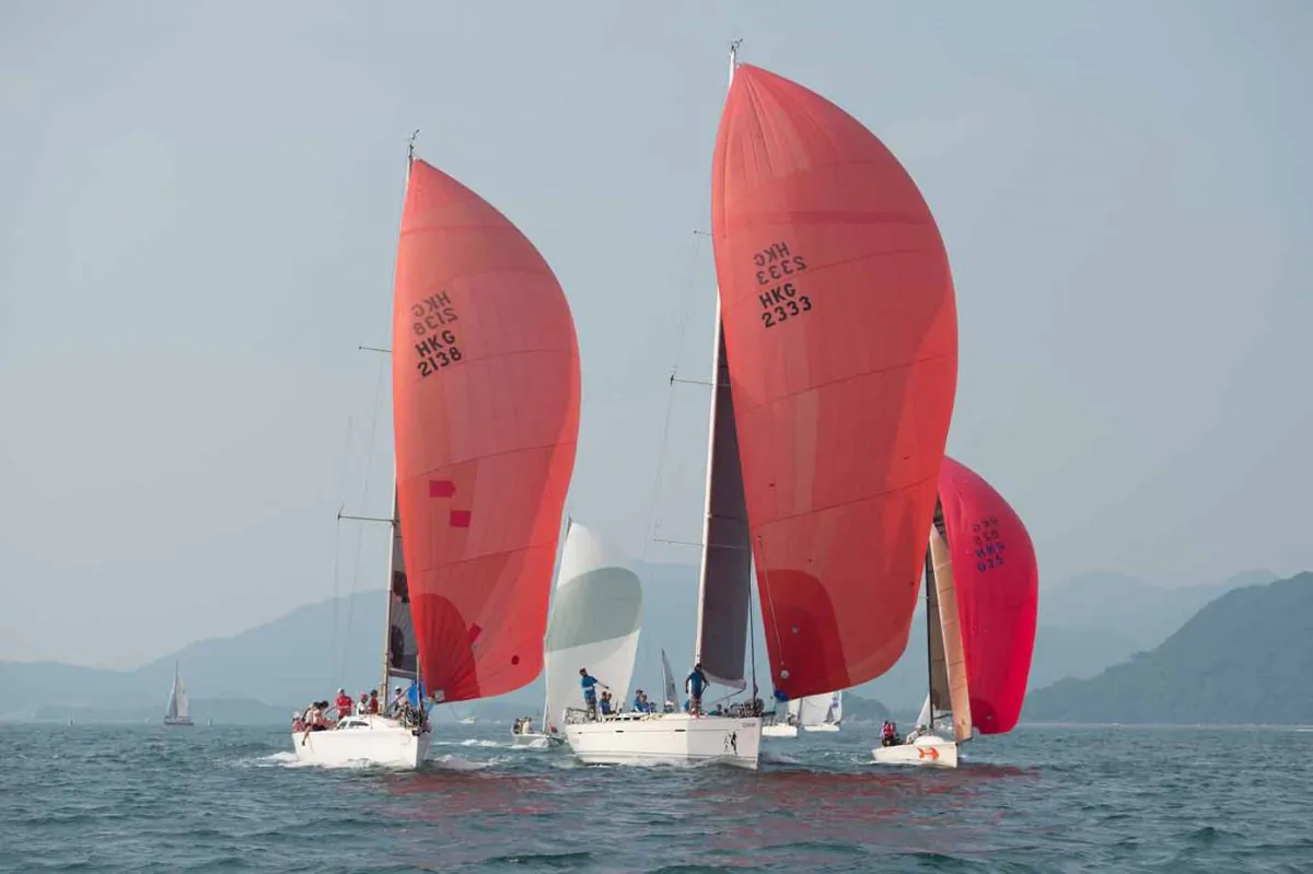 ‘Stella’, ‘Lighthorse’ and ‘Red Herring II’ head downwind in the final race of the UK Sailmakers Summer Saturday Series in Port Shelter on Saturday August 8, 2015. (Bill Cox/Epoch Times)