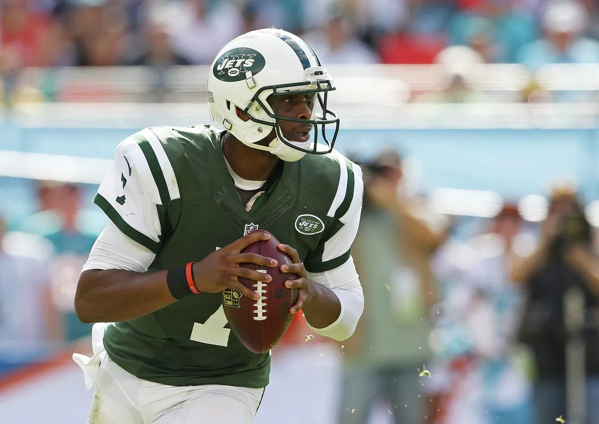 Quarterback Geno Smith #7 of the New York Jets looks for a receiver in the second quarter during a game against the Miami Dolphins at Sun Life Stadium on December 28, 2014 in Miami Gardens, Florida. (Mike Ehrmann/Getty Images)