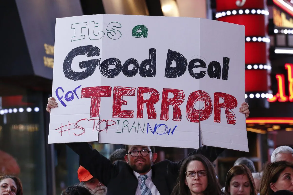 A man holds a poster during a rally against the nuclear deal with Iran in Times Square in New York on July 22, 2015. (Kena Betancur/AFP/Getty Images)