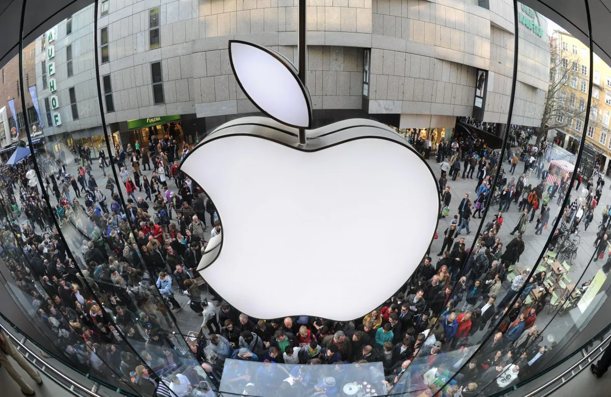 A giant Apple logo can be seen as customers wait for the new Apple iPad 2 in front of the Apple-store in the southern German city of Munich on March 25, 2011. (Christof Stache/AFP/Getty Images)