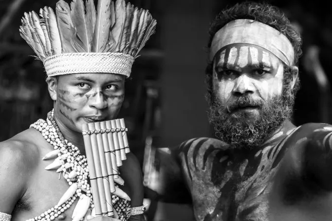 Left: A young man participates in a Native ritual in the Amazon in Brazil. (Filipe Frazao/iStock) Right: An Aboriginal man performs on Australia Day in Sydney, Australia, on Jan. 26, 2014. (PhotographyByDonnaG/iStock)