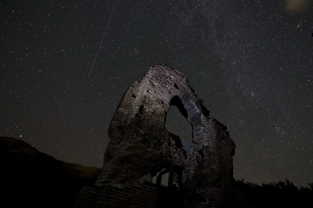A long exposure image showing an aeroplane passing in the sky during the Perseids meteor shower over the remains of St. Ilia Roman early Christian basilica dated back to the 5th6th century AD near the town of Pirdop, early on August 12, 2015. The Perseid meteor shower occurs every year in August when the Earth passes through the debris and dust of the Swift-Tuttle comet. The Perseid meteor shower -- an annual display of natural fireworks -- should be particularly spectacular this year, with extra-dark skies expected to create optimal stargazing conditions, astronomers said on August 7, 2015. (Nikolay Doychinov/AFP/Getty Images)