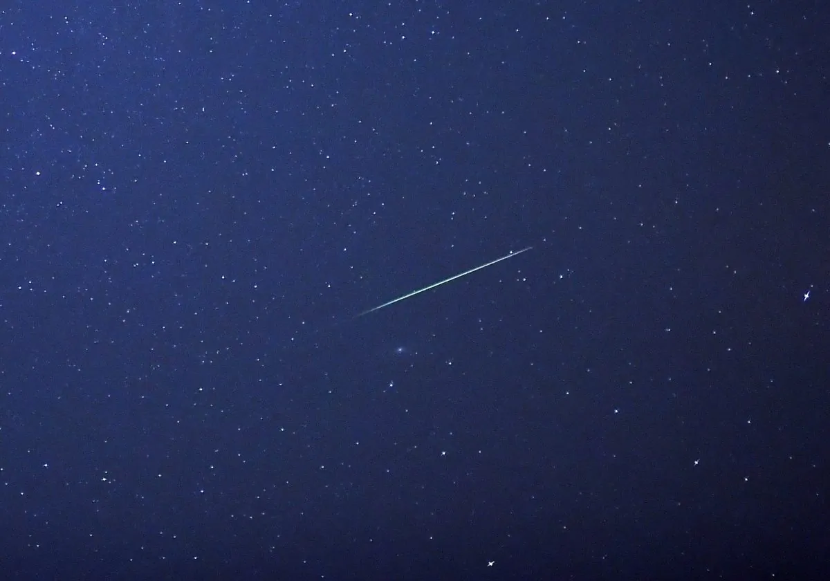 A falling star crosses the night sky over Halle / Saale, eastern Germany, during the peak in activity of the annual Perseids meteor shower on August 13, 2015. The Perseids meteor shower occurs every year when the Earth passes through the cloud of debris left by Comet Swift-Tuttle. (Hendrik Schmidt/AFP/Getty Images)