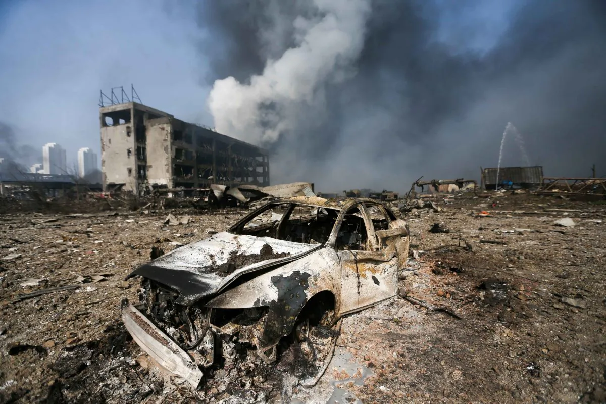 A damaged car is seen on Aug. 13 at the site of the massive explosions in Tianjin. (STR/AFP/Getty Images)