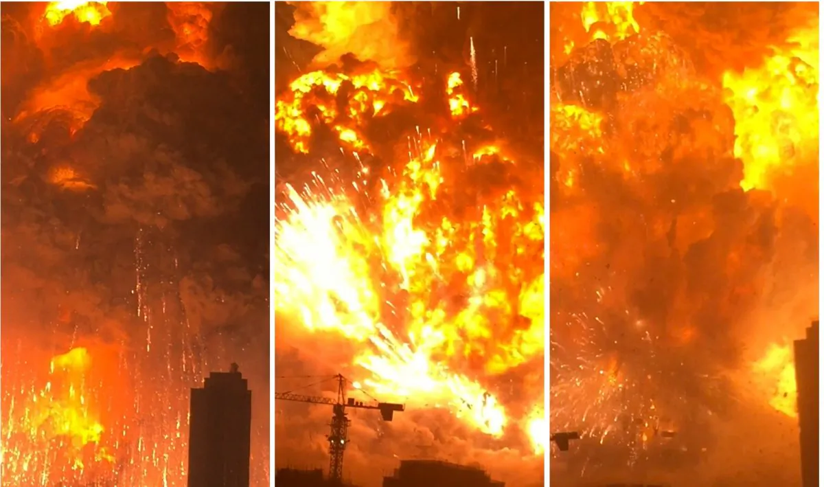 In this combination of Aug. 12, 2015, images taken from video provided by Dan Van Duren a warehouse explodes in Tianjin, China, as filmed from a nearby residential building. Tianjin is the world's 10th largest port. (Dan Van Duren via AP)
