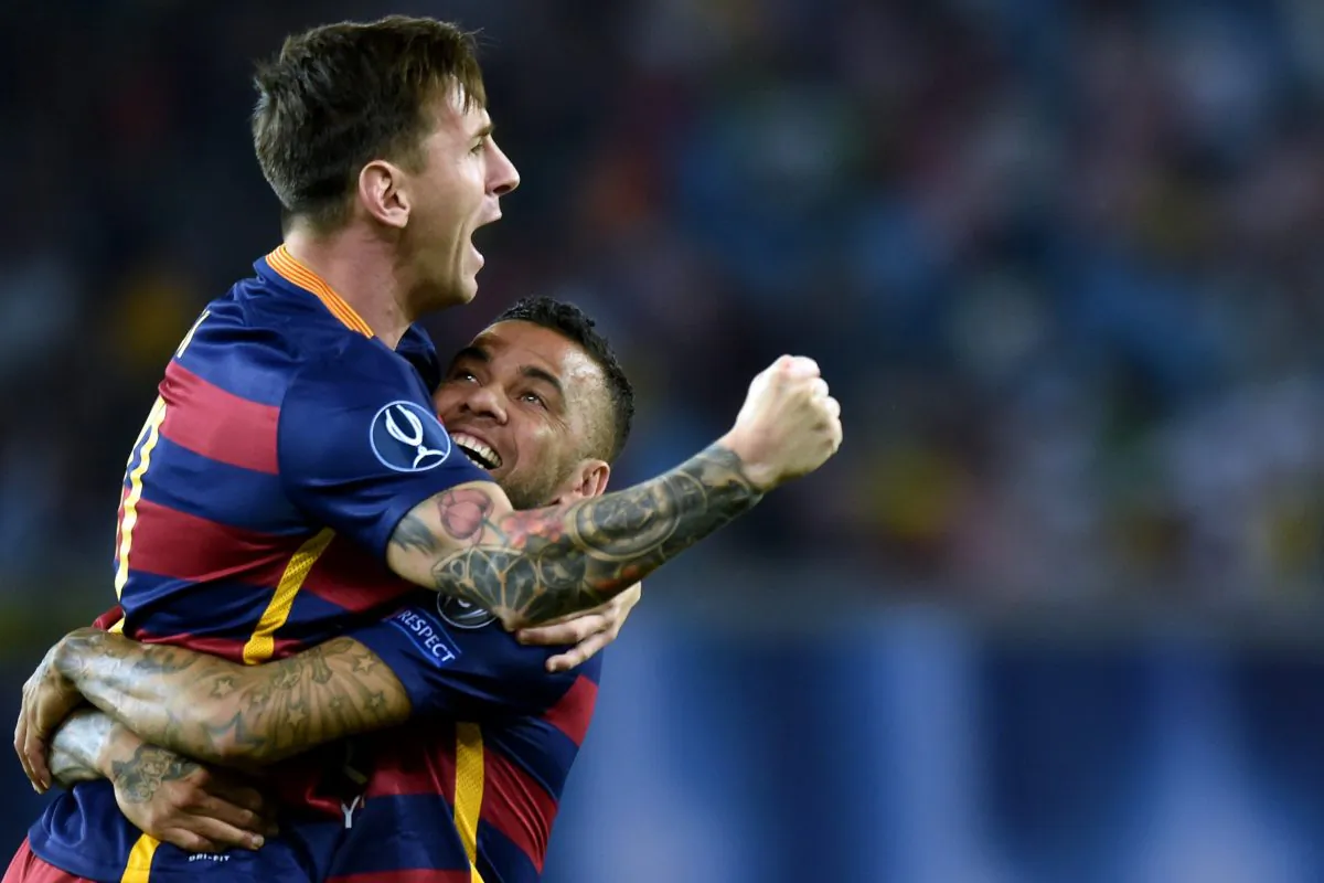 Barcelona's Brazilian defender Dani Alves (R) and Barcelona's Argentinian forward Lionel Messi (L) celebrate after scoring a goal during the UEFA Super Cup final football match between FC Barcelona and Sevilla FC in Tbilisi on August 11, 2015. (Kirill Kudryavtsev/AFP/Getty Images)