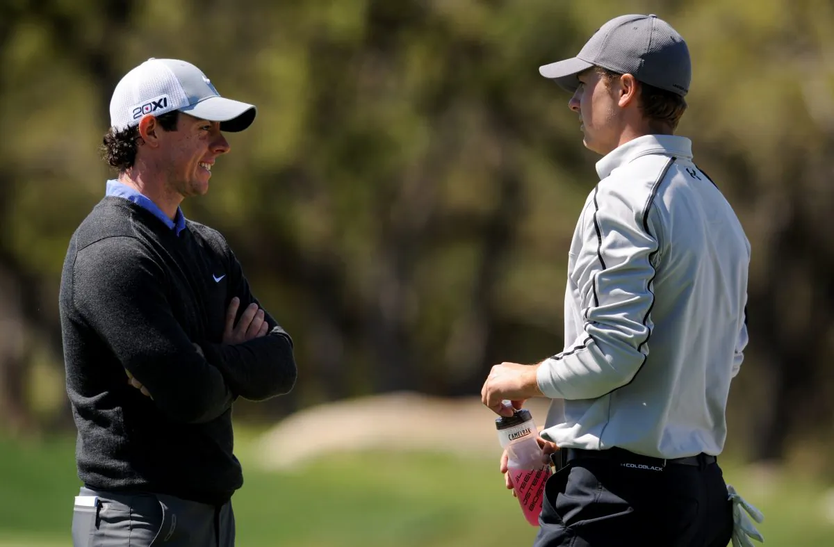 Rory McIlroy of Northern Ireland talks with Jordan Spieth on the 6th hole during the first round of the Valero Texas Open at the AT&T Oaks Course at TPC San Antonio on April 04, 2013 in San Antonio, Texas. (Photo by Steve Dykes/Getty Images)
