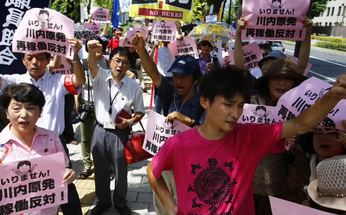 Protesters at the restart of Japan’s Sendai 1 reactor. (AP Photo/Shizuo Kambayashi)