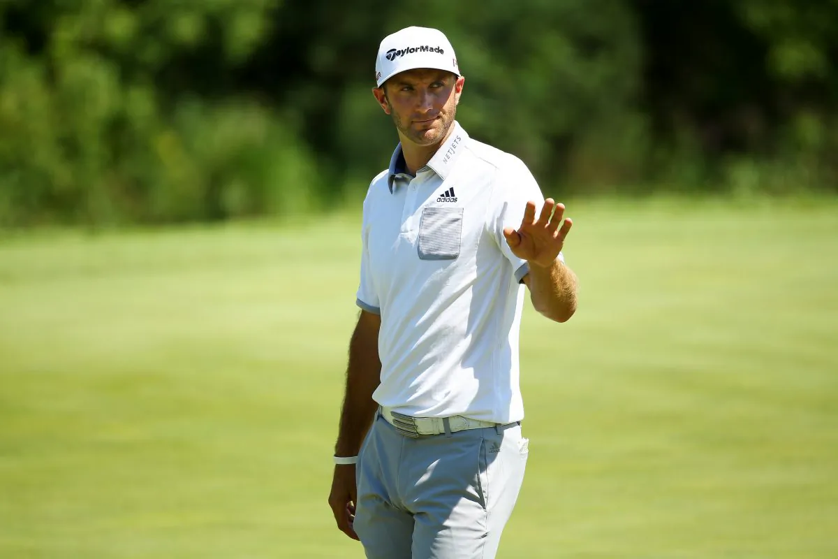 Dustin Johnson waves to the crowd on the ninth green during the first round of the 2015 PGA Championship at Whistling Straits on August 13, 2015 in Sheboygan, Wisconsin. (Richard Heathcote/Getty Images) 