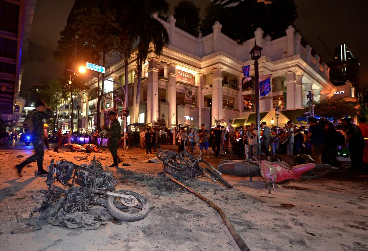 Thai soldiers inspect the scene after a bomb exploded outside a religious shrine in central Bangkok late on August 17, 2015 killing at least 10 people and wounding scores more. Body parts were scattered across the street after the explosion outside the Erawan Shrine in the downtown Chidlom district of the Thai capital. (Pornchai Kittiwongsagul/AFP/Getty Images)