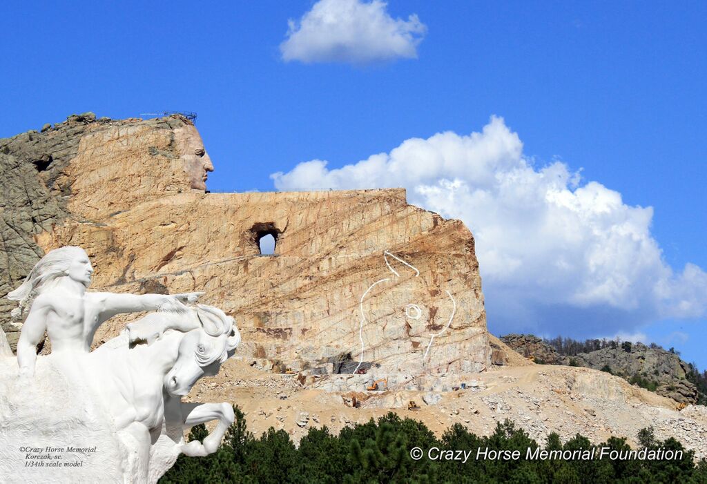 Crazy Horse Memorial circa 2014. To put the scale of the memorial in perspective, Mount Rushmore is roughly the size of Crazy Horse’s face. The outstretched arm is longer than the length of a football field. The next phase of the carving is the hand above the horse’s head. (Crazy Horse Memorial Foundation)