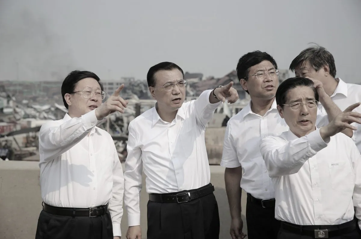 Chinese premier Li Keqiang (2nd L) inspecting the site of the massive explosions in Tianjin. (STR/AFP/Getty Images)