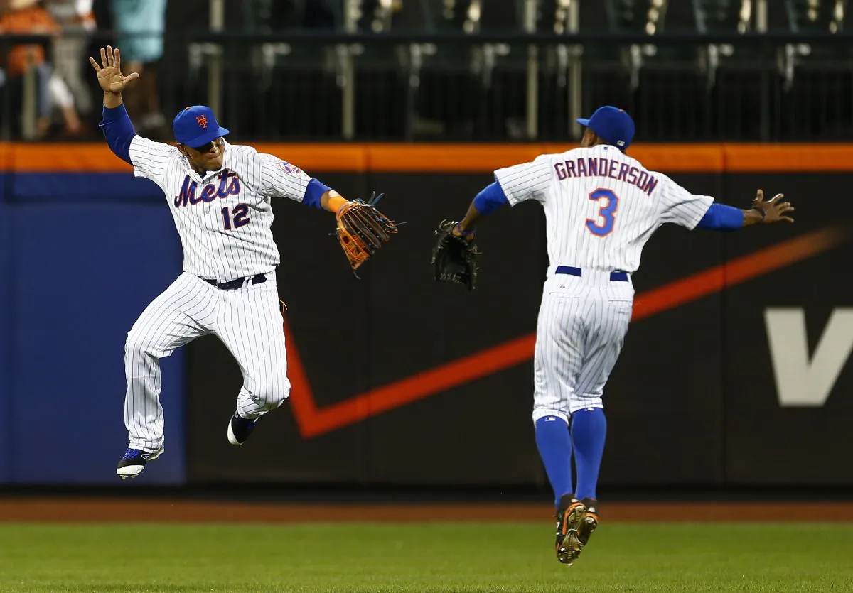 Juan Lagares (L) and Curtis Granderson have the Mets in prime position for a postseason run. (Rich Schultz/Getty Images)