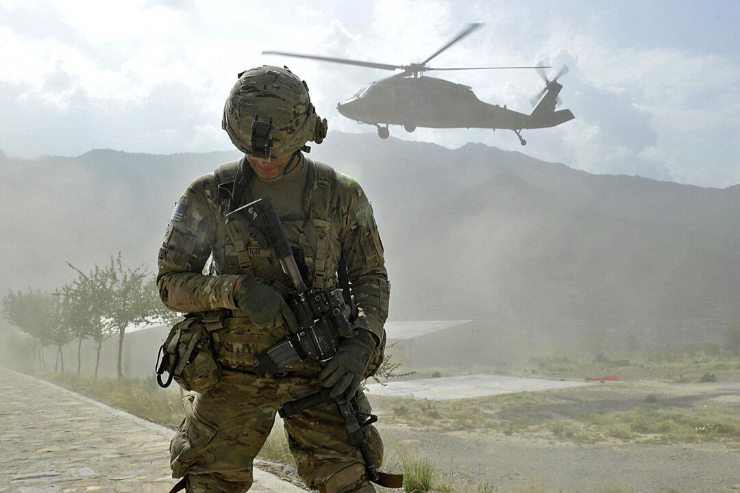 A soldier from the U.S. Army's Bravo Company secures a landing zone for a Black Hawk helicopter in Kunar Province, Afghanistan, on Sept. 15, 2011. (Tauseef Mustafa/AFP/Getty Images)