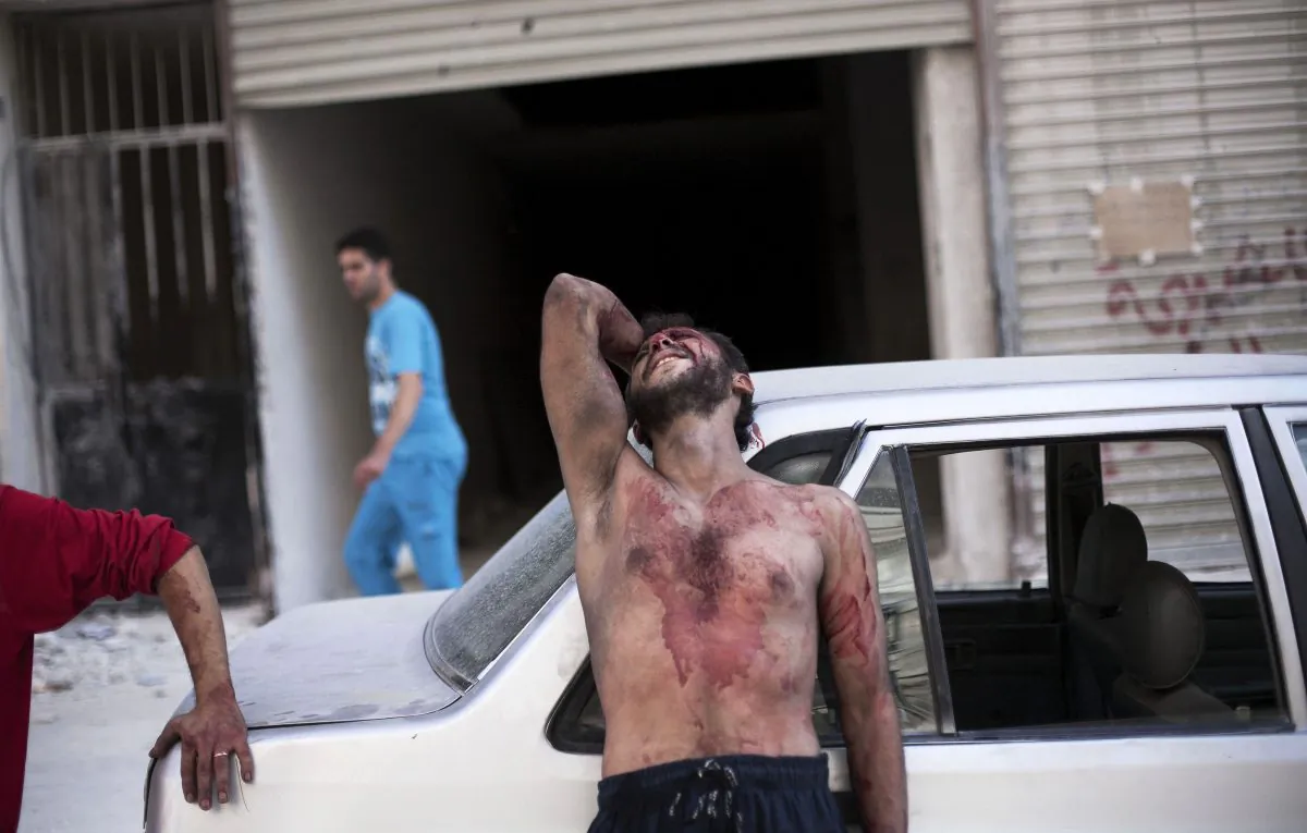 In this Thursday, Oct. 4, 2012 file photo, a Syrian man cries outside the Dar El Shifa hospital in Aleppo, Syria after his daughter was injured during a Syrian Air Force strike over a school where hundreds of refugees had taken shelter. Syria's uprising was not destined to be quick.  (AP Photo/ Manu Brabo)