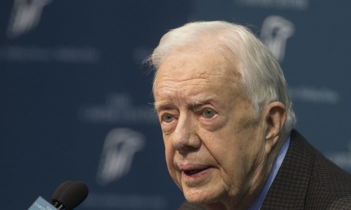 Former President Jimmy Carter talks about his cancer diagnosis during a news conference at The Carter Center in Atlanta on Thursday, Aug. 20, 2015. Carter announced that his cancer is on four small spots on his brain and he will immediately begin radiation treatment, saying he is "at ease with whatever comes." (AP Photo/Phil Skinner)