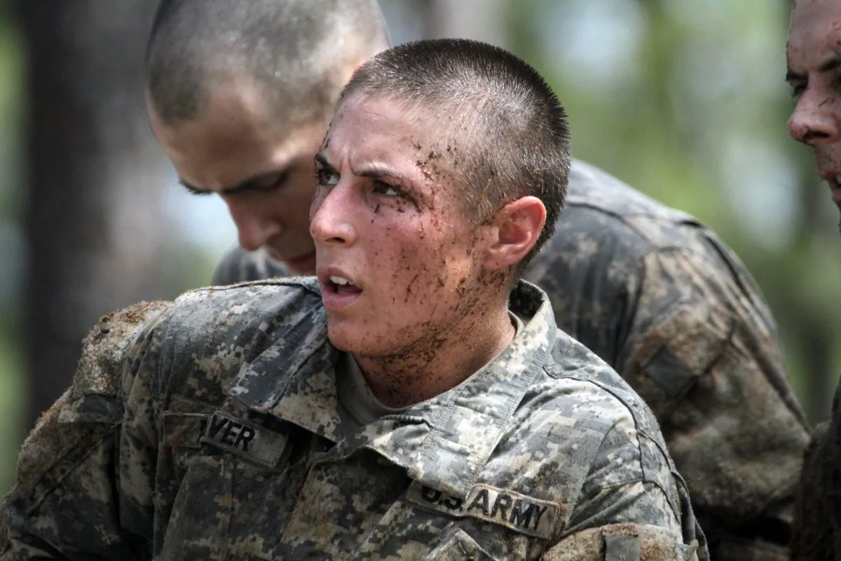 In this April 26, 2015, photo, 1st Lt. Shaye Haver, one of the 20 female soldiers, who is among the 400 students who qualified to start Ranger School, tackles the Darby Queen obstacle course, one of the toughest obstacle courses in U.S. Army training, at Fort Benning, in Ga. (Robin Trimarchi/Ledger-Enquirer via AP)