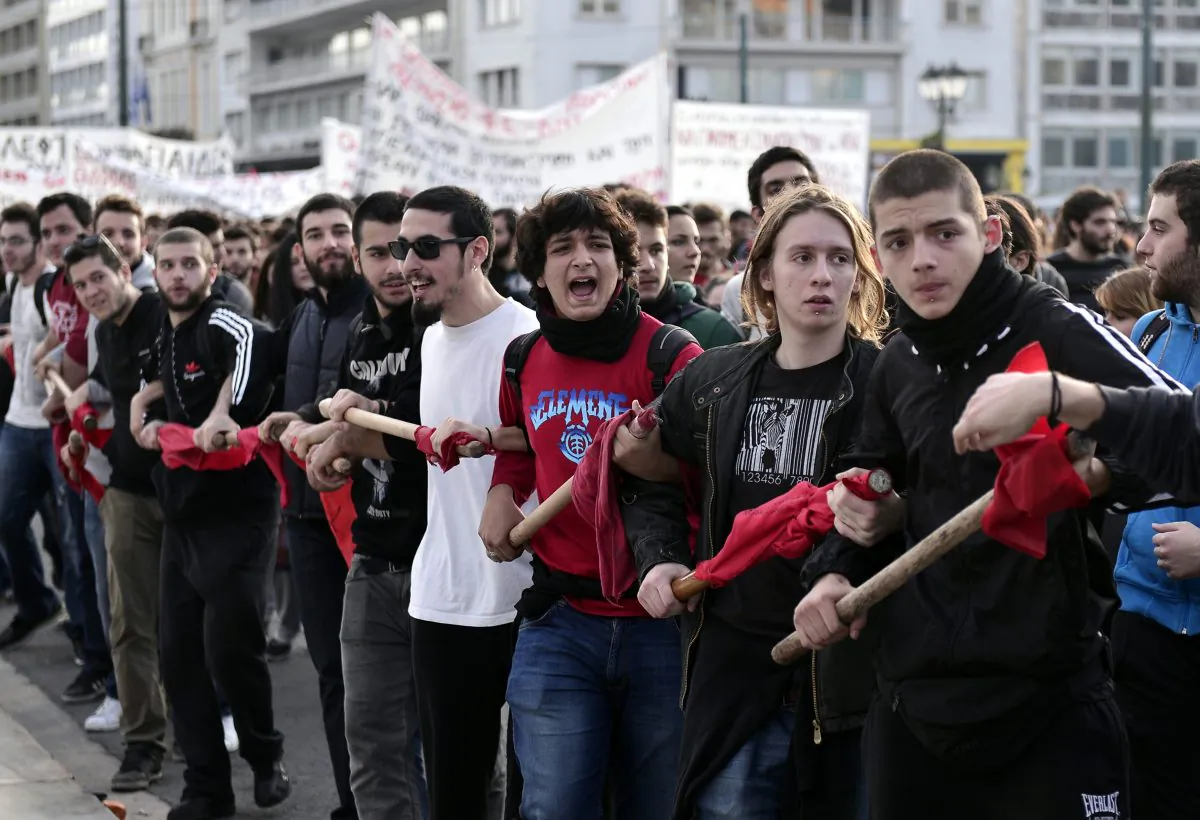 Students protest against educational reform, lack of teachers, and layoffs of administrative staff, in front of the Greek parliament, in Athens, on Nov. 6, 2014. (Louisa Gouliamaki/AFP/Getty Images)