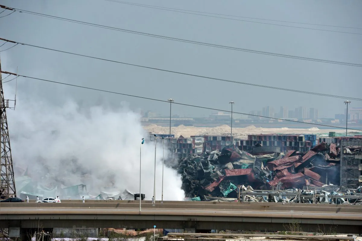 This photo taken on August 16, 2015 shows smoke rising from the site of the explosions in Tianjin. (STR/AFP/Getty Images)