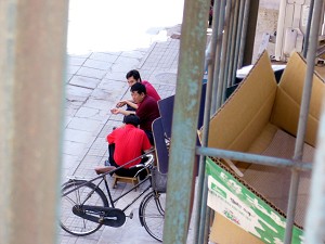 Plainclothes agents who harassed Gao are seen waiting outside of Gao's home. (The Epoch Times) 