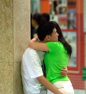 A Chinese couple hug at a subway station in central Beijing. (Teh Eng Koon/AFP/Getty Images)
