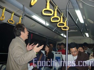 Sun Wenguang is promoting his own concepts of democracy on the school bus. (The Epoch Times)