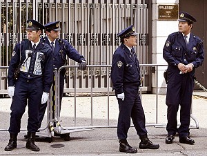 Policemen stand guard in front of the Chinese Embassy in Tokyo. (Toru Yamanaka/AFP/Getty Images)