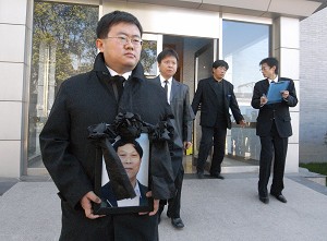 A portrait of Bao Zunxin is carried by family at a funeral home in Beijing. Bao played an important role in the democracy movement in China, which culminated in the massacre by the Chinese military, of hundreds if not thousands of people in 1989. (Frederic J. Brown/AFP/Getty Images)