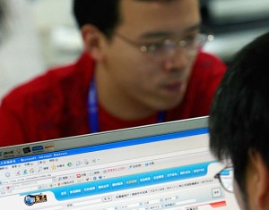 Chinese men surf the internet in Beijing on September 22, 2007.(Teh Eng Koon/AFP/Getty Images)