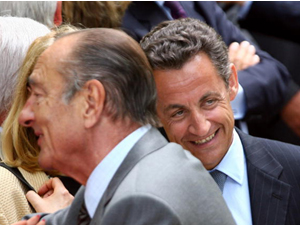 French President Jacques Chirac (L) and President-elect Nicolas Sarkozy (R) greet the crowd 10 May 2007 at the Luxembourg gardens in Paris, Chirac did much to support the Chinese regime despite its horrendous human rights record; the Chinese regime hopes Sarkozy will do the same.(Thomas Coex/AFP/Getty Images)