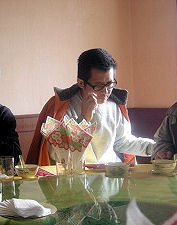 Guo Feixiong enjoying a meal and quiet time with friends. The Epoch Times