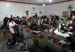 Workers making shoes in Sichuan Province. In response to criticisms from the world about the quality of products made in China, the Chinese Communist Party (CCP) has begin airing a series of special documentaries in China called "Believe in Made in China." (Getty Images)