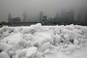 Snow sits near the skyline of the Lujiazui Financial District in Shanghai, China. Due to an ice disaster in southern China, the power transmission from other provinces to Guangdong has been greatly reduced. (China Photos/Getty Images)