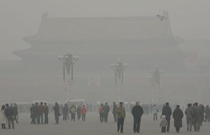 Tourists walk through heavy fog over Tiananmen Square in Beijing, 27 December 2007. (Teh Eng Koon/AFP/Getty Images)