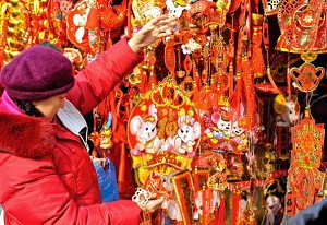 People in Beijing browse for Chinese New Year decoration hangers (The Eng Koon /AFP/Getty Images) 
