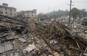 The debris is scattered all over the collapsed township May 17, 2008 in Dujiangyan of Sichuan Province, China. (China Photos/Getty Images)
