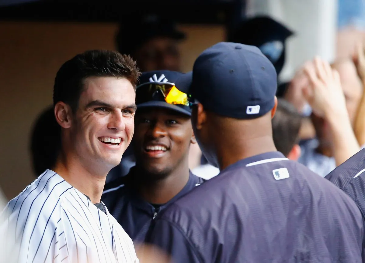 Greg Bird #31 of the New York Yankees celebrates his sixth inning home run against the Minnesota Twins with his team during their game at Yankee Stadium on August 19, 2015 in New York City.  (Al Bello/Getty Images)