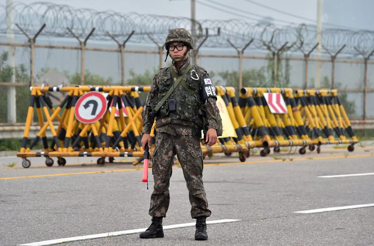 A South Korean soldier stands on the road leading to North Korea's Kaesong joint industrial complex at a military checkpoint in the border city of Paju on August 21, 2015. (Jung Yeon-Je/AFP/Getty Images)