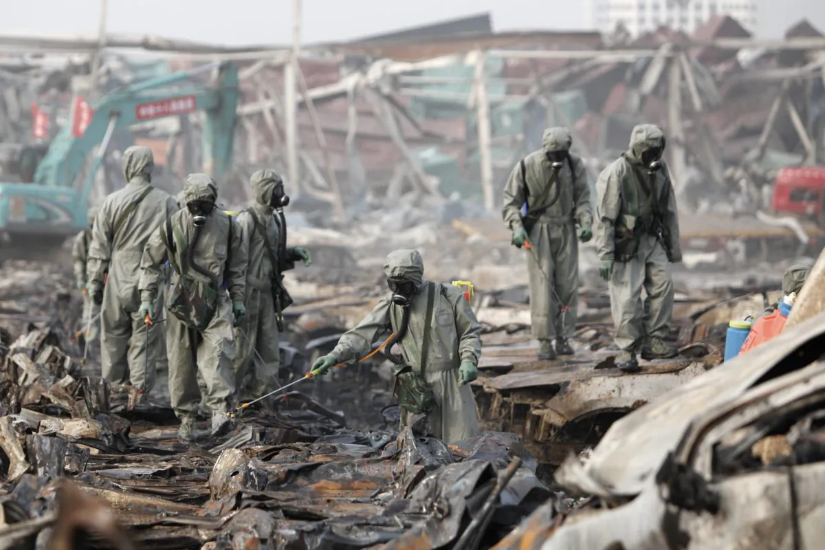 Rescuers spray hydrogen peroxide at the site of Tianjin warehouse explosion on Aug. 20, 2015 in Tianjin, China. (ChinaFotoPress/Getty Images)