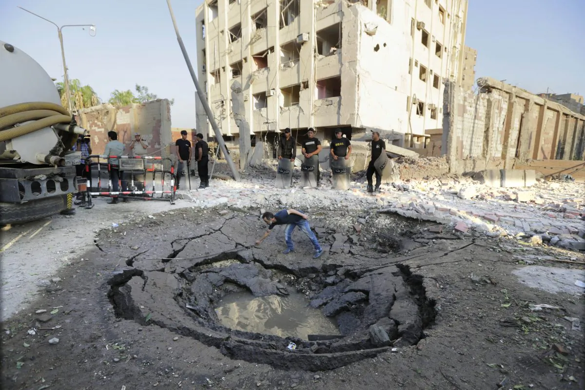 A hole caused by a car bomb in front of the damaged national security building in Cairo, Egypt, on Aug. 20, 2015. (Amr Nabil/AP)
